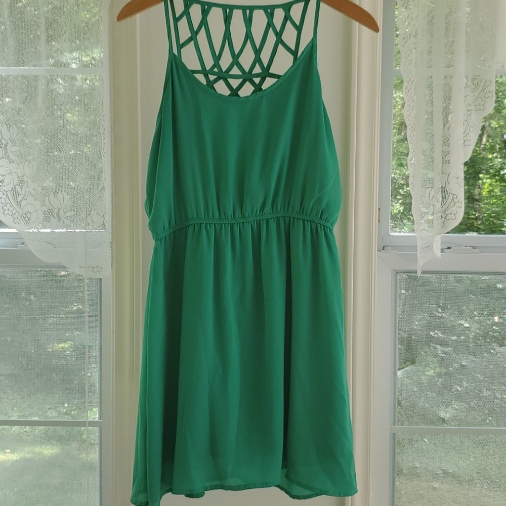 Green spaghetti strap dress with details on back